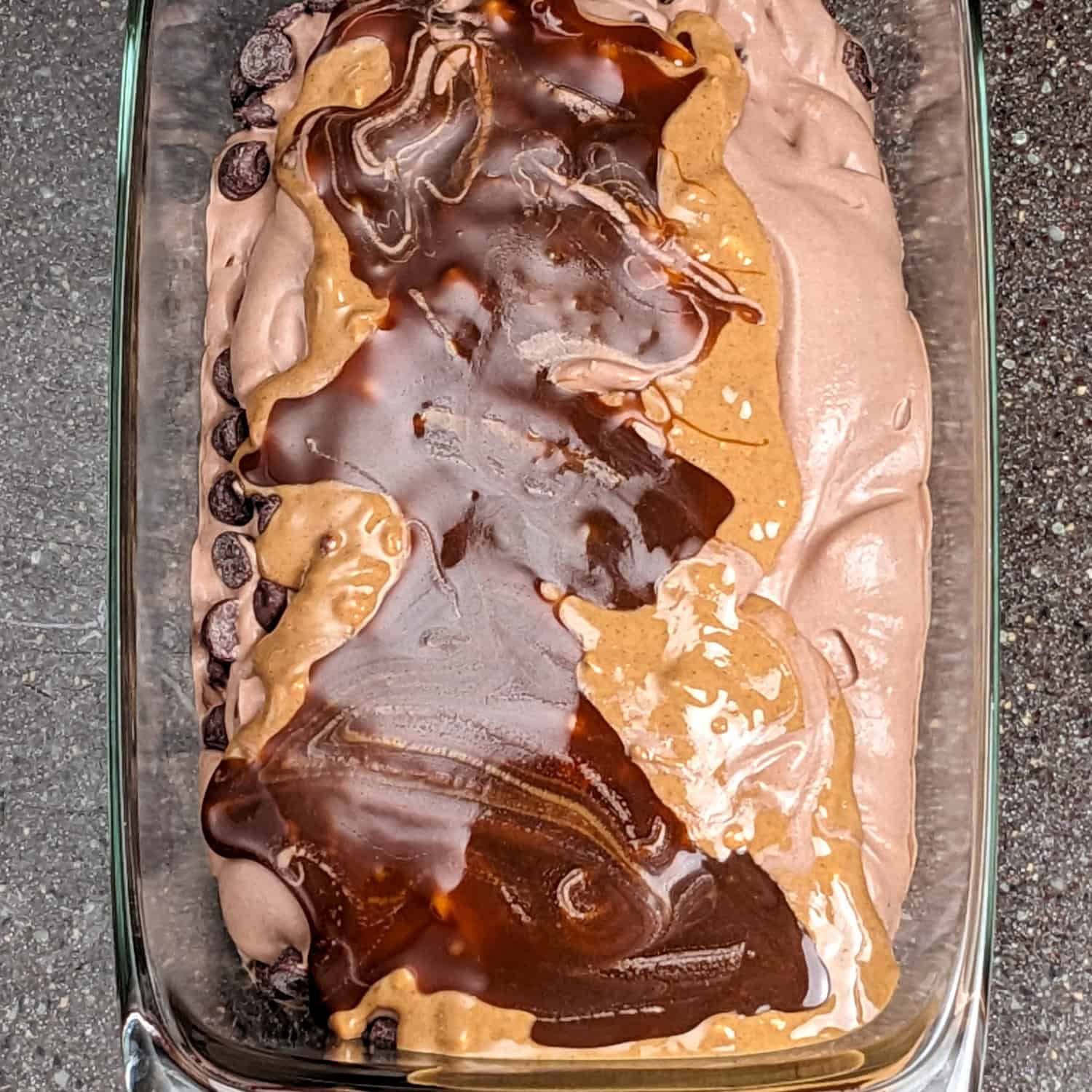 Decadent no-churn chocolate peanut butter ice cream with rich layers and chocolate sauce.